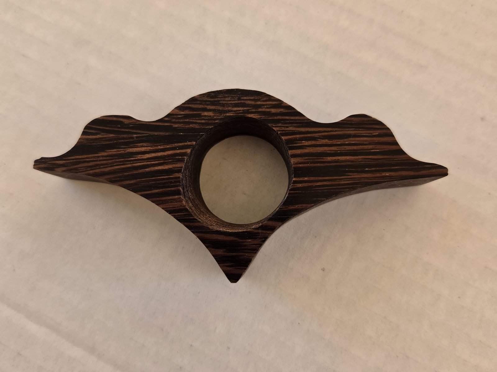Scallop thumb book holder in wenge, handmade by Gilbert