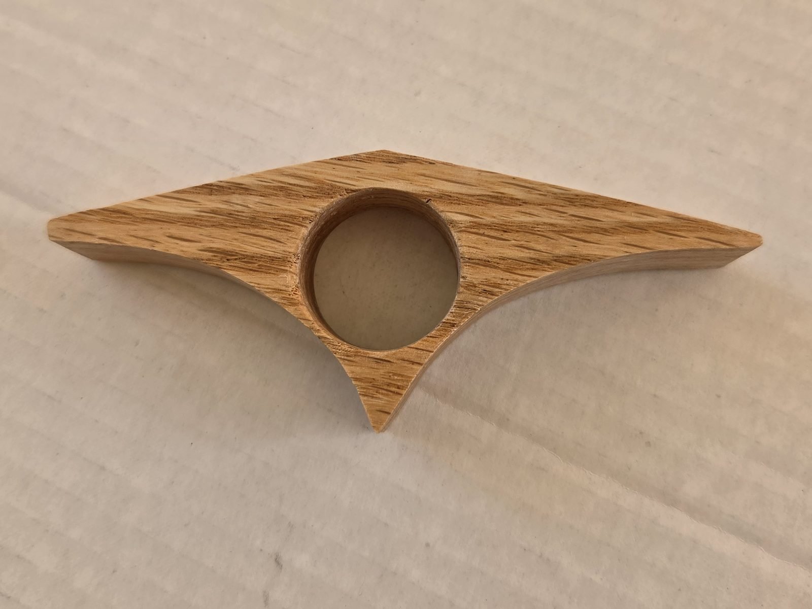 Curved Triangle thumb book holder in oak, handmade by Gilbert