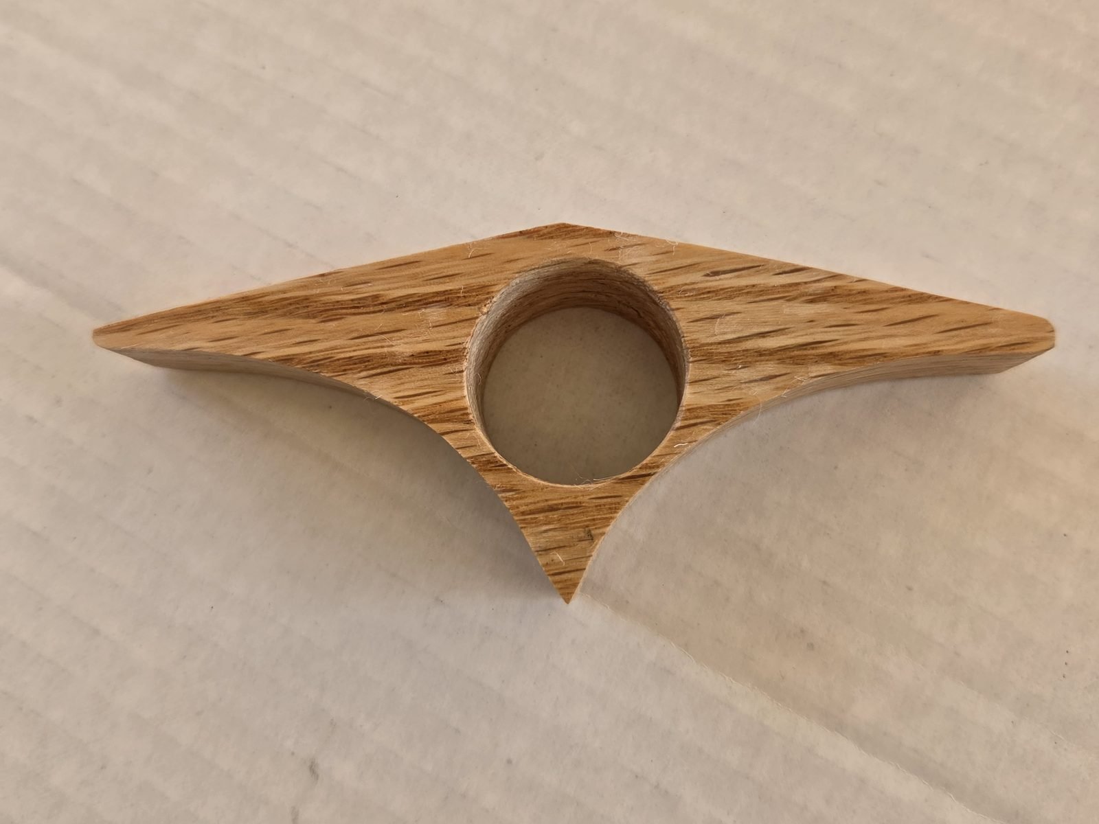 Curved Triangle thumb book holder in oak, second view