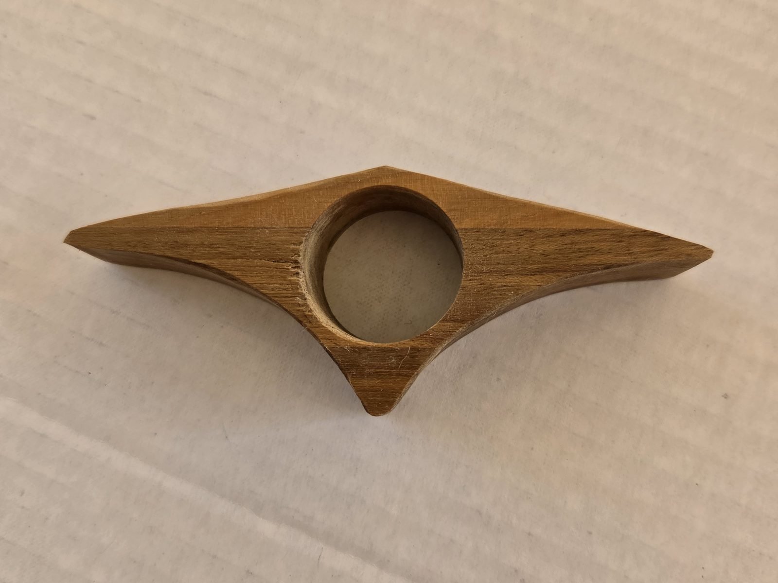 Curved Triangle thumb book holder in teak, handmade by Gilbert