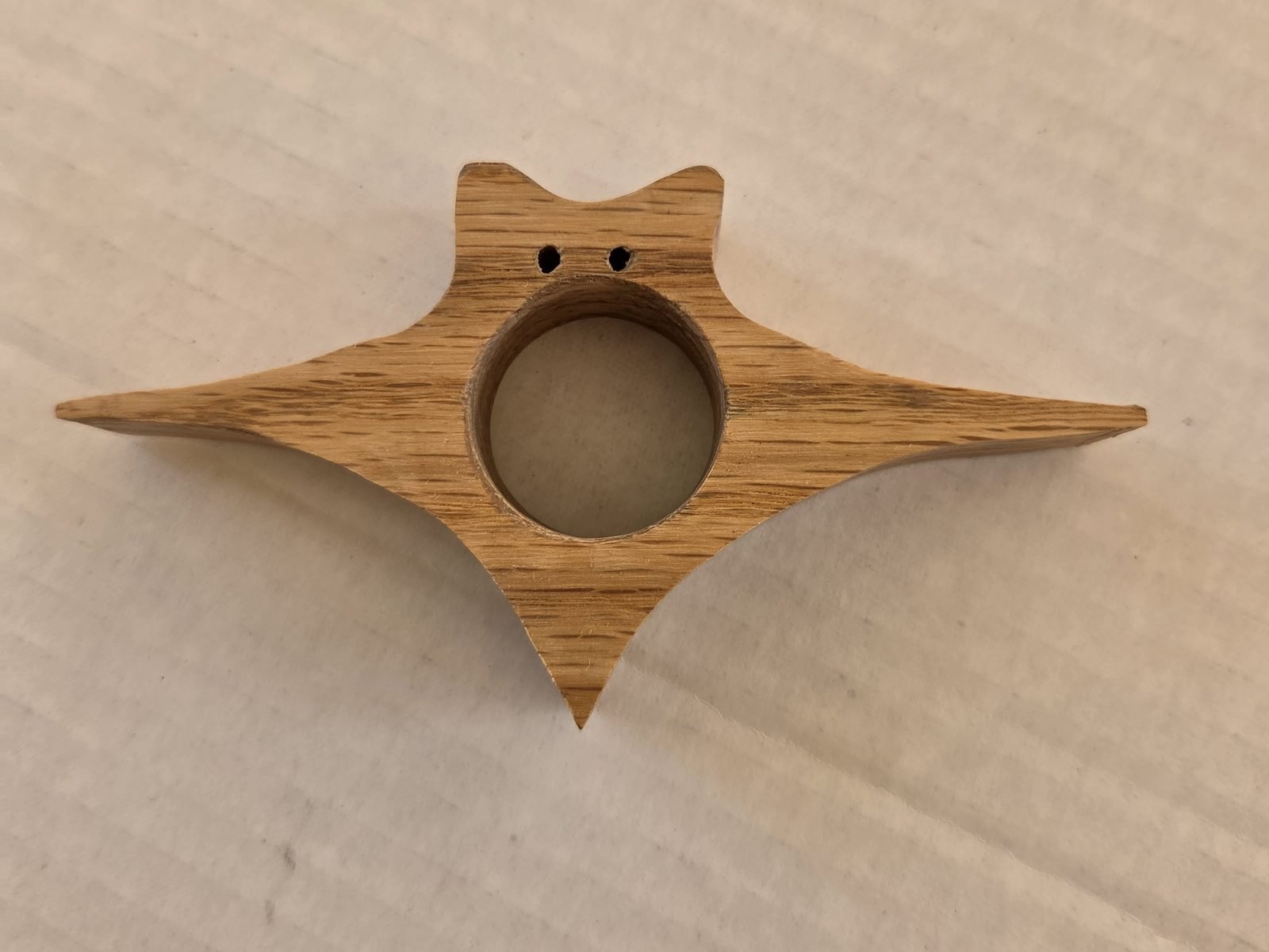 Winged Cat thumb book holder in oak, handmade by Gilbert