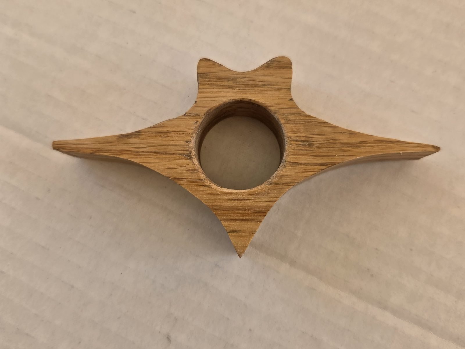Winged Cat thumb book holder in oak, second view