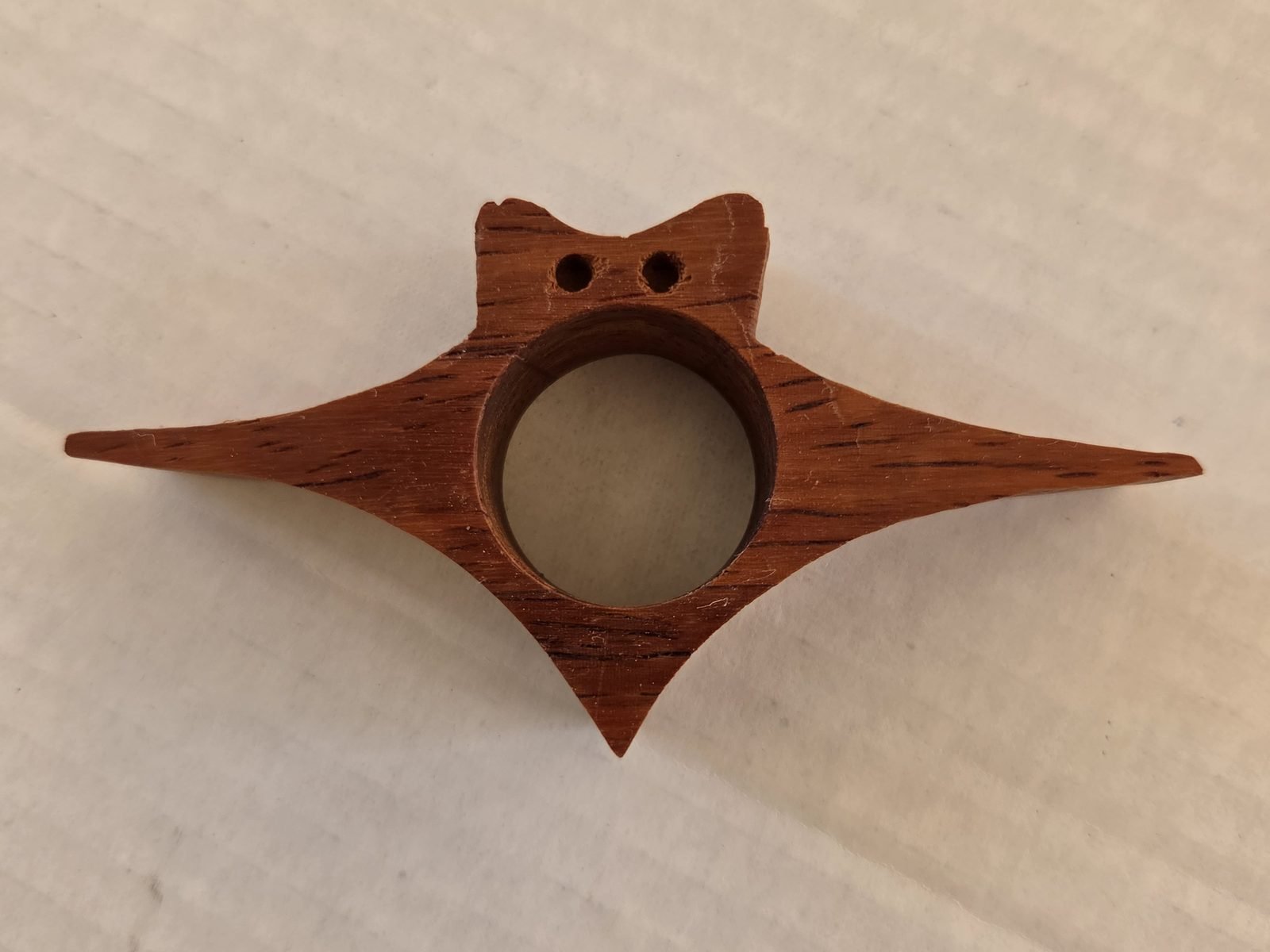 Winged Cat thumb book holder in padauk, handmade by Gilbert