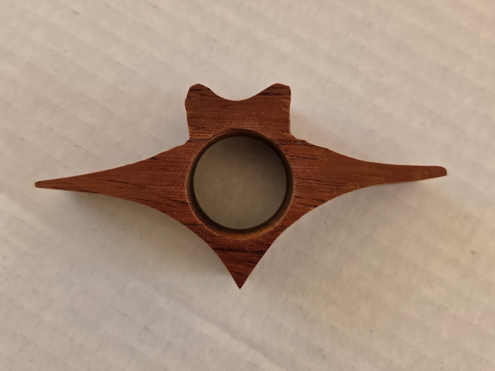 Winged Cat thumb book holder in padauk, second view