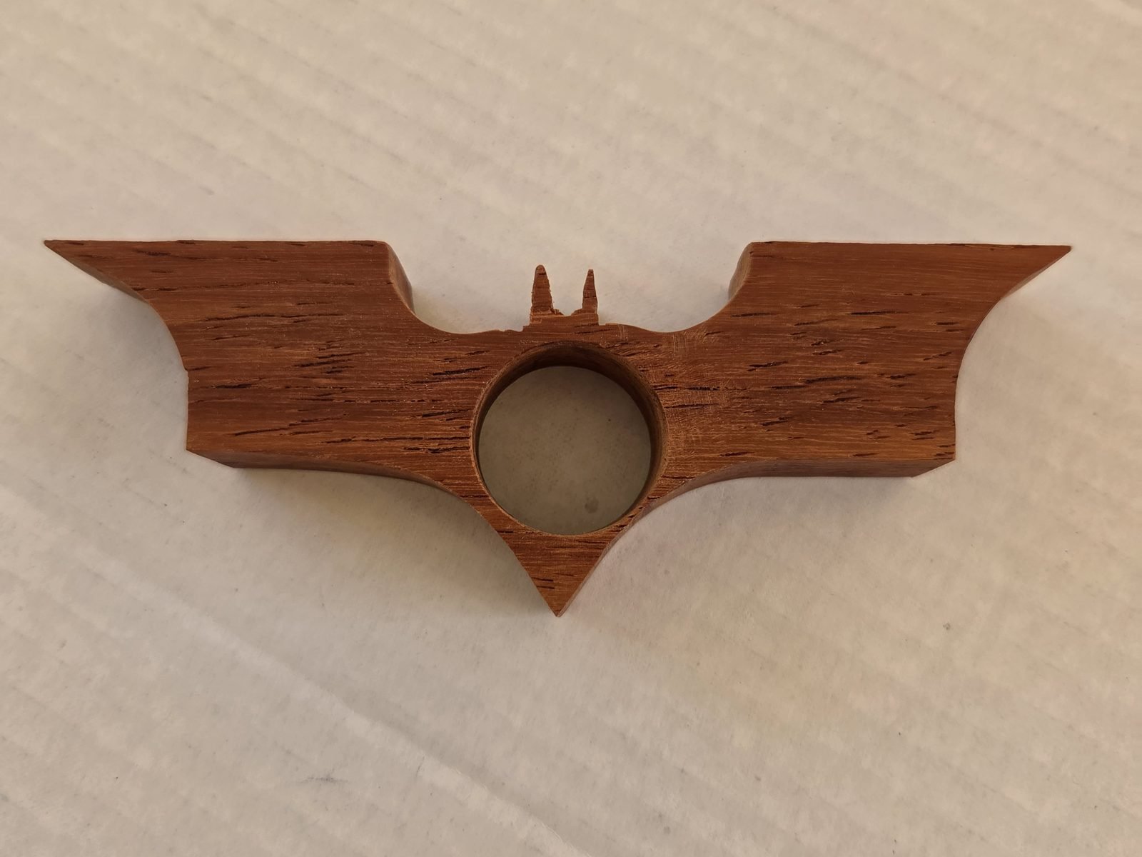 Bat thumb book holder in padauk, second view